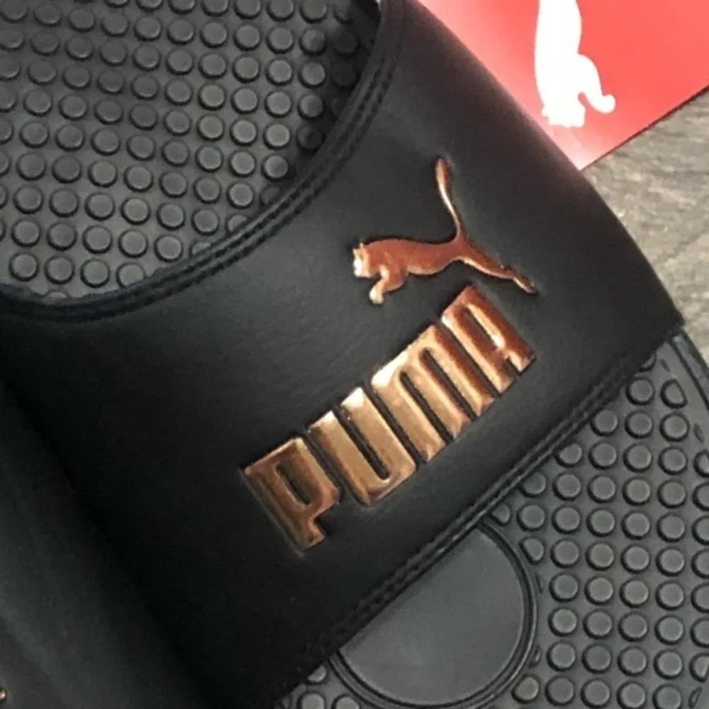 Puma women’s slides black and rose gold sporty activewear athletic streetwear